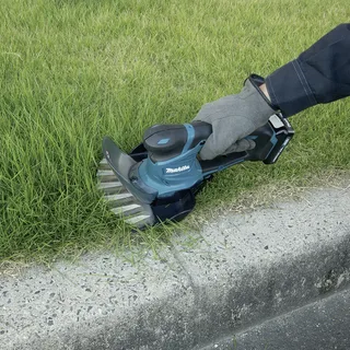 UM600DSMEX UM600DSMEX sans fil Cisaille à gazon, Sculpte-haie avec 2ème batterie 10.8 V Li-Ion de Makita – image du produit 2 sur 3